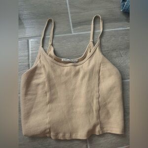 It’s a tan cropped tank top it’s new I have never worn it